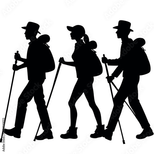 Three hikers with backpacks and trekking poles walking together