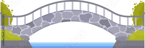 Small stone bridge crossing calm blue water, featuring a metal railing and surrounded by lush bushes, creating an ideal setting for relaxing walks in a peaceful park