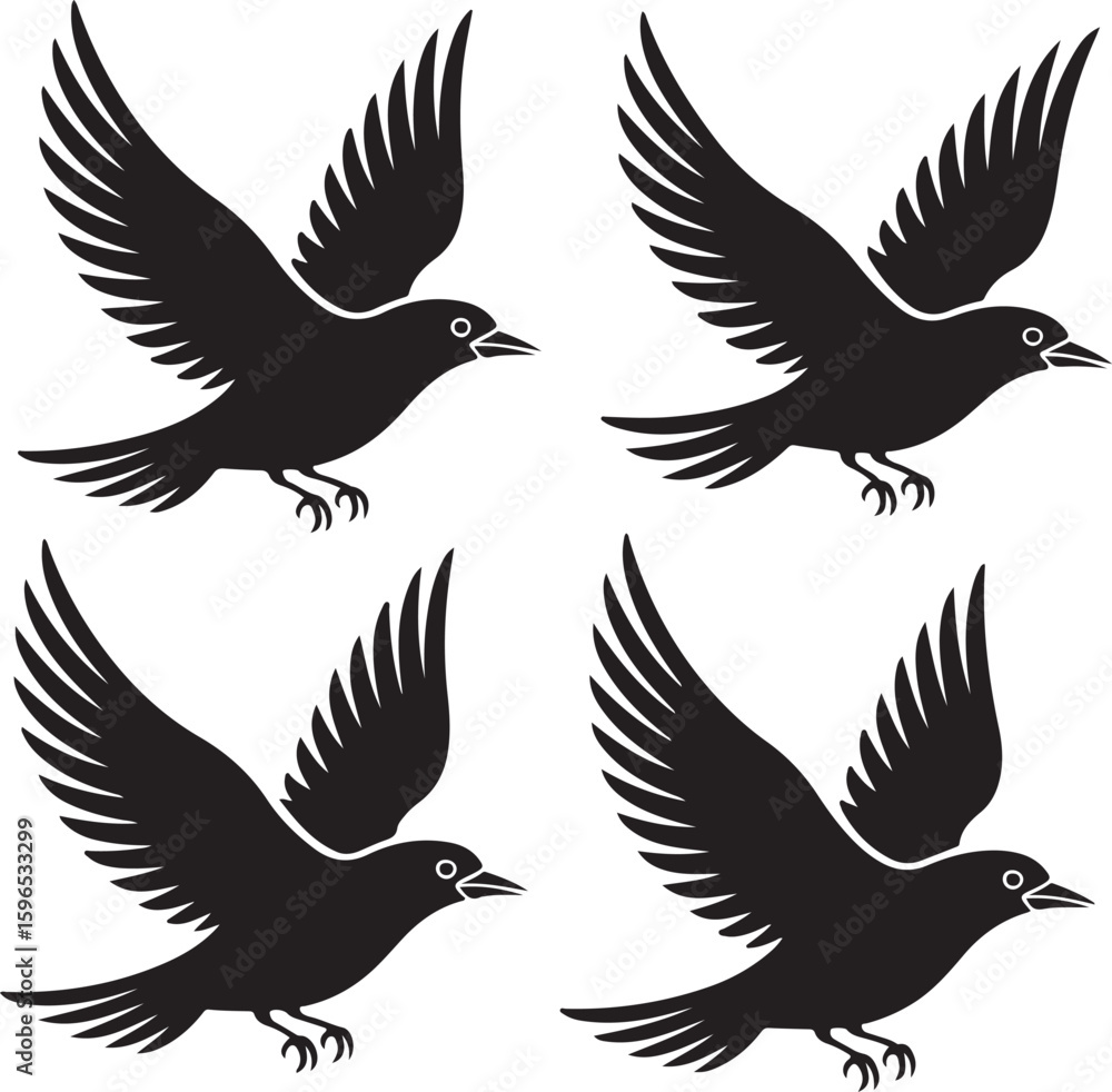 Fototapeta premium Four black birds in flight with spread wings flying