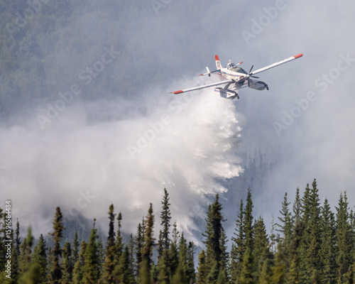 Fire Boss dropping water on wildfire.