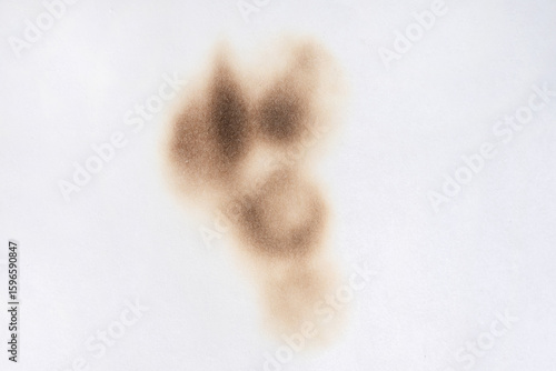 Paper burn black  stain. Round paper burn mark close up. burns borders paper close up