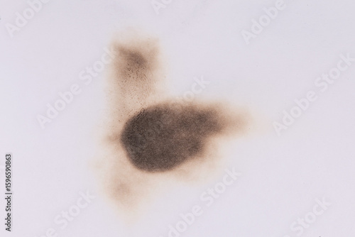 Paper burn black  stain. Round paper burn mark close up. burns borders paper close up