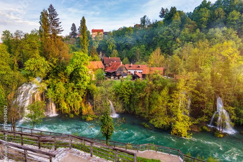 Fotografia Village of Rastoke near Slunj in Croatia, old water mills on waterfalls of Korana river, beautiful countryside landscape