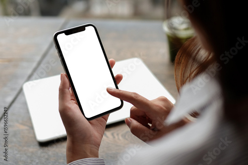 Phone in woman hand, white mockup screen, close up view.