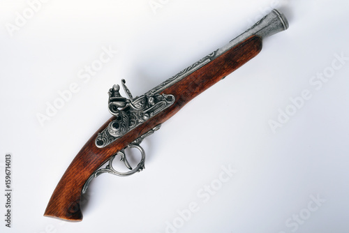 Tableau sur toile 18th century flintlock pirate pistol replica isolated on white background
