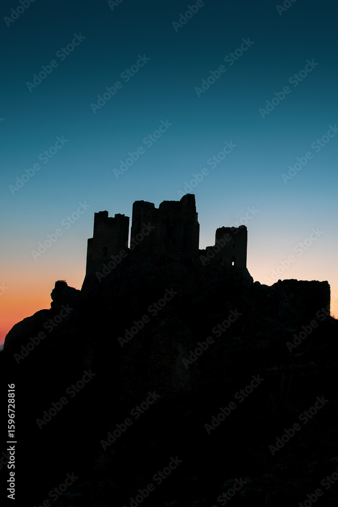Obraz premium Italy, July 5, 2025: Ruins of Rocca Calascio Castle, an Italian tourist destination and landmark in the Gran Sasso National Park, L'Aquila, Abruzzo. Clear blue skies at .