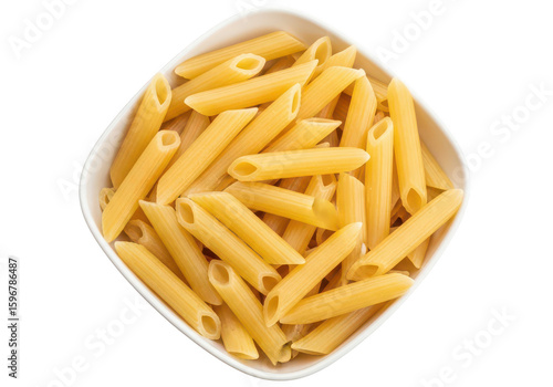 Close up top down view of dry penne pasta in a white bowl uncooked food