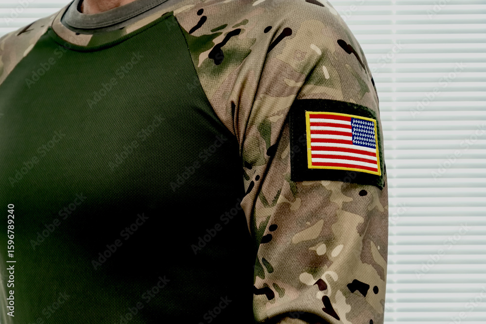 Obraz premium Camouflage uniform with American flag. Modern US military uniform.