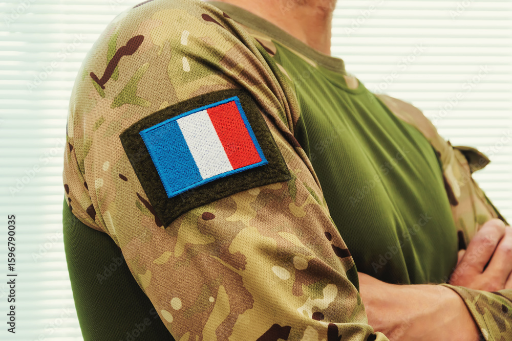 Obraz premium Modern military uniform with camouflage and French flag.