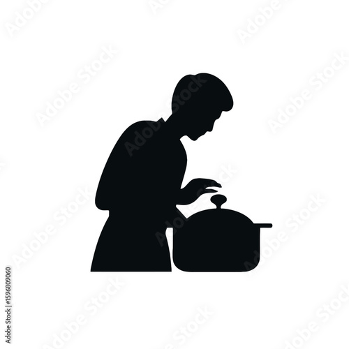 Cooking Silhouette: A monochromatic silhouette of a person absorbed in the act of cooking. This image captures the essence of culinary practice, highlighting focus on the process.