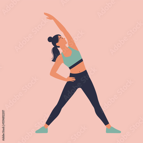 Athletic woman with a ponytail doing a side bend stretch in modern activewear
