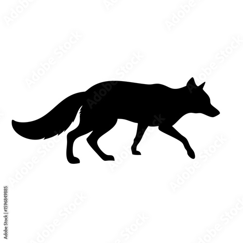 fox silhouette in stalking pose with bushy tail