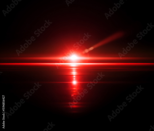 Bright red light rays emanating from a bright white center on black light streaks