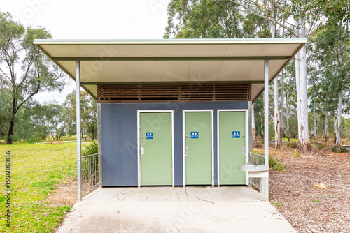 Photography Photograph of a small outdoor public toilet block amongst trees in public parkland in Yarramundi Reserve in the Hawkesbury Region of NSW, Australia