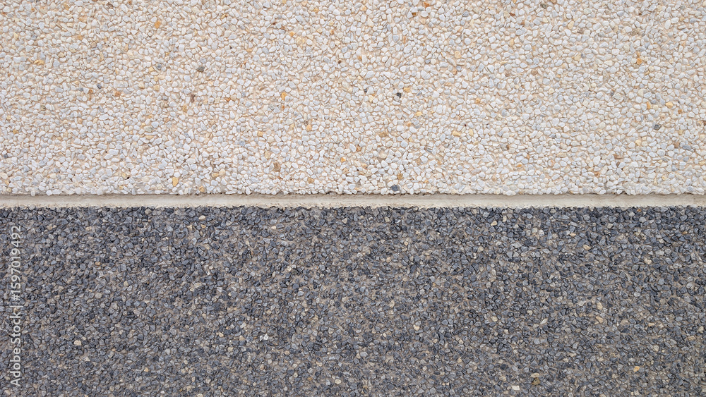 Fototapeta premium Exposed aggregate surface with double natural texture of gravel stone and small stones in light and dark tones with cement or concrete for interior or exterior wall cladding. 