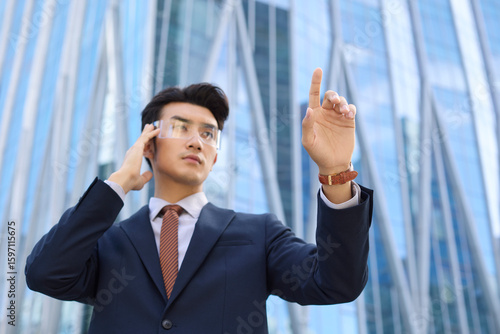 Young businessman wearing smart glasses