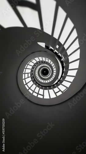 Spiral staircase design with shadows in modern building