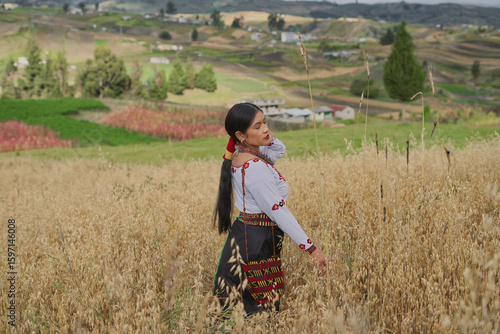 Wallpaper Mural Indigenous woman wearing traditional andean clothing walks through a field of wheat in the andes mountains Torontodigital.ca