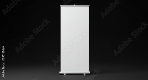 A blank white pullup banner stands centered against a dark background