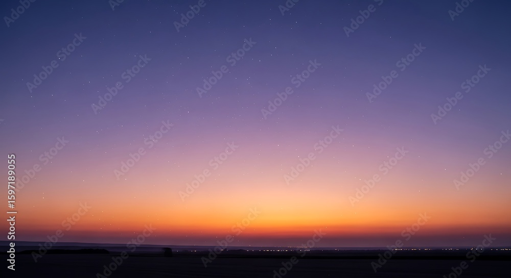 Fototapeta premium Colorful sunset with stars illuminating the horizon over the desert landscape creating a serene