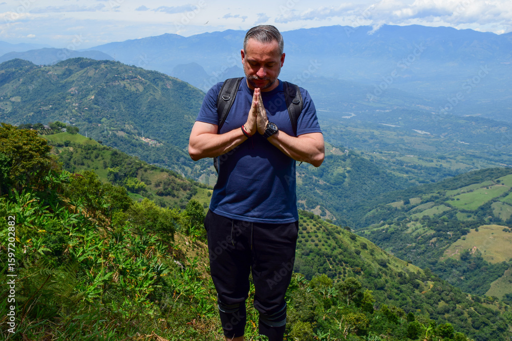 Naklejka premium Mindful Man Practicing Gratitude in Nature – Meditation and Inner Peace on a Mountain in Colombia
