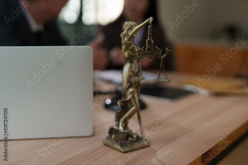 Lawyers and business people discuss legal matters in the office.