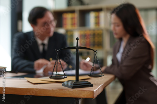 Lawyers and business people discuss legal matters in the office.