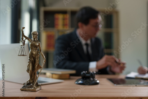 Lawyers and business people discuss legal matters in the office.