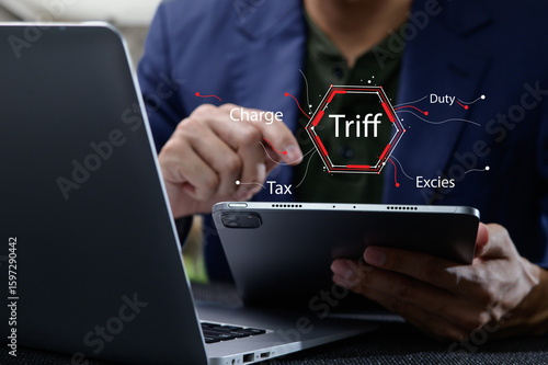 Wallpaper Mural Businessman Analyzing Tax Principles on Tablet with Laptop Nearby Torontodigital.ca