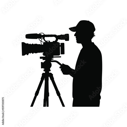 Filmmaker silhouette operating a professional video camera on a tripod