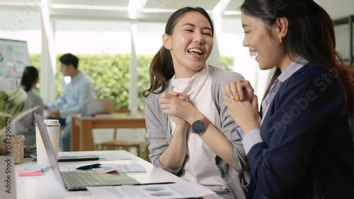Young adult asian people asia woman high five smile work at office receive idea good news email happy joy bonus pay win sale award, order test job exam result, loan money banking approve e-mail winner