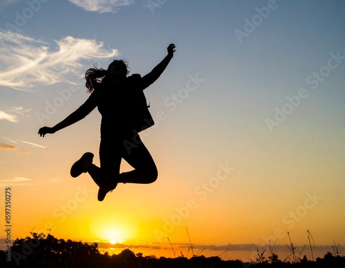 Wallpaper Mural Silhouette of a person jumping with joy at sunset, celebration and success theme Torontodigital.ca