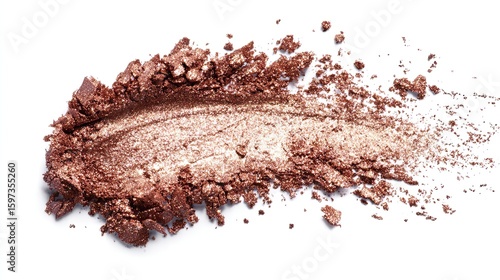 Close-up of a swirled, crushed, bronze-toned eyeshadow swatch on a white background.