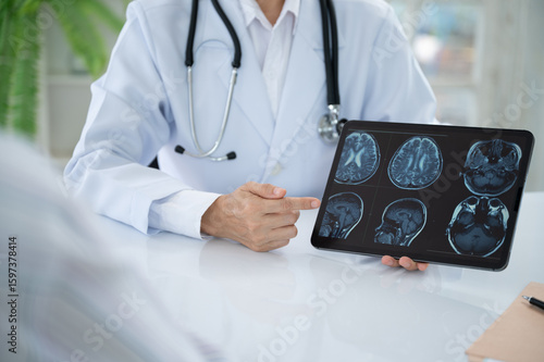 Neurologist Doctor treatment planning for diseases nervous system and brain with patient about cerebrovascular disease, migraine, Parkinson's disease, dementia and stroke at Neurology Center.