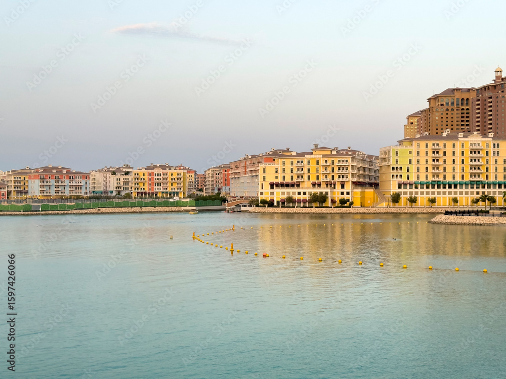 Fototapeta premium Doha, Qatar - July 19, 2025: Qanat Quartier luxury apartment in Pearl, Qatar. Doha