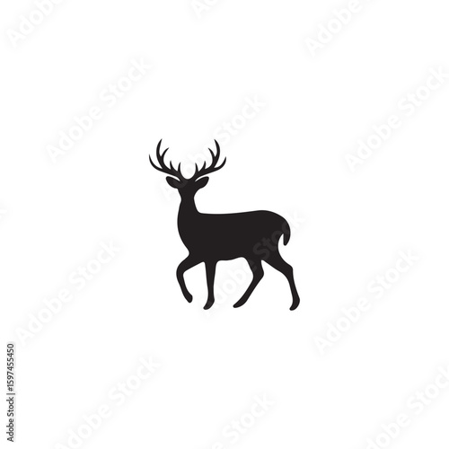 Black silhouette of a stag with large antlers walking deer animal