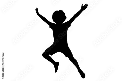 Silhouette of a boy jumping with arms raised high