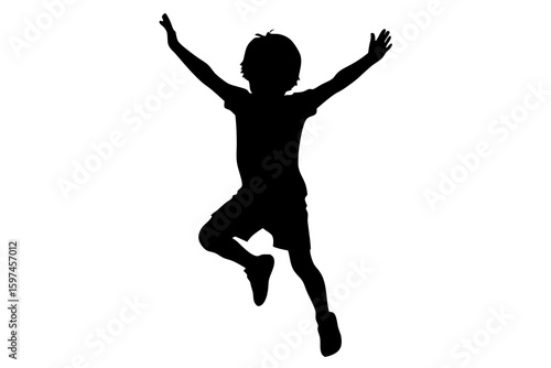 Silhouette of boy jumping with arms raised high