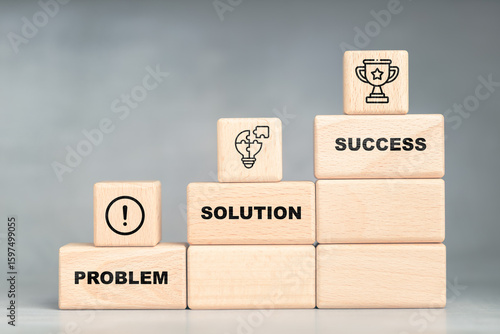 Wooden blocks stacked in steps labeled problem, solution, and success, symbolizing growth, strategy, problem-solving, and achieving goals in business or personal development