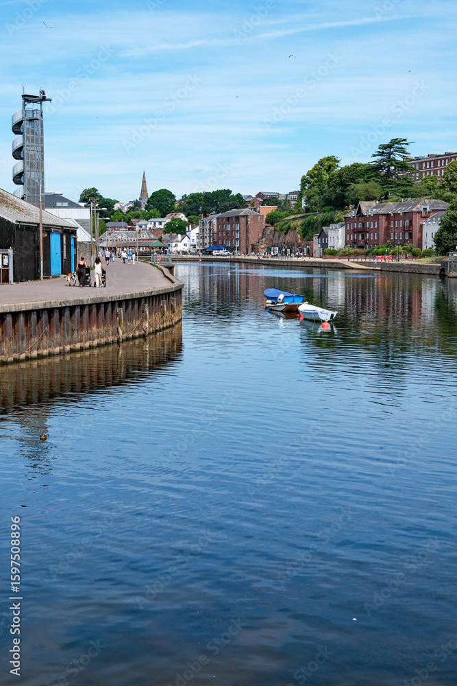 Fototapeta premium Quayside canal basin, with businesses across the water. Central city tourist attraction and historic landmark. Popular visitor location.