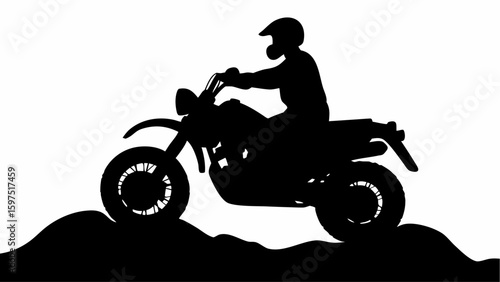 Silhouette of a motorcyclist with helmet riding a motorcycle on a hilly terrain in black and white view