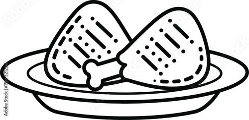 Two pieces of outline fried chicken on a plate ready to be served