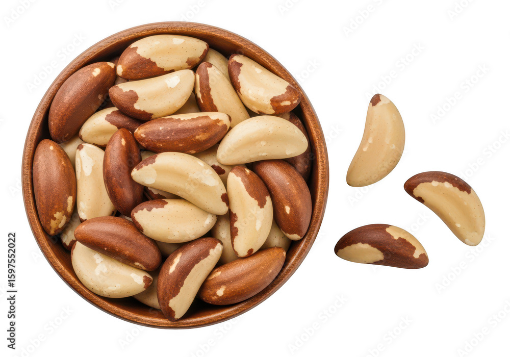 Wooden bowl filled with Brazil nuts scattered on food Wooden bowl filled with Brazil nuts scattered on food