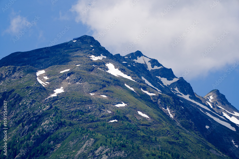 Fototapeta premium Scenic view of mountain peak in the Swiss Alps at Lötchental Valley on a sunny late spring day. Photo taken June 19th, 2025, Lötschental, Switzerland.