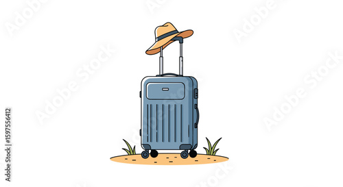 A blue travel suitcase with a straw hat on top resting on sandy ground