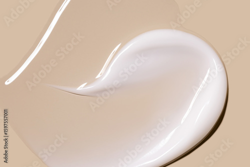 Fototapeta creamy texture of cosmetic samples on a pastel beige background