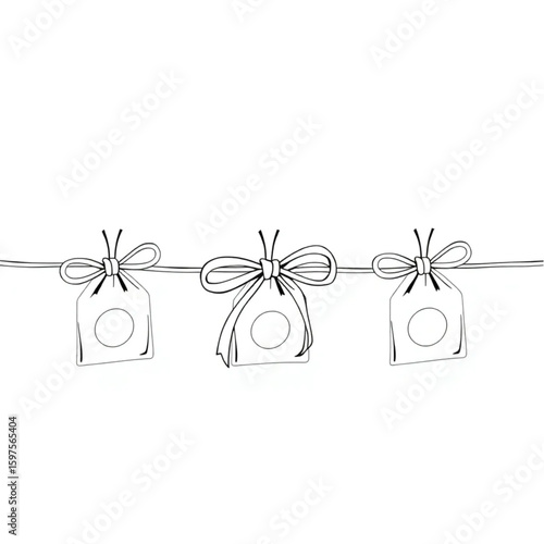A hand tying ribbons on a line of homemade party favors