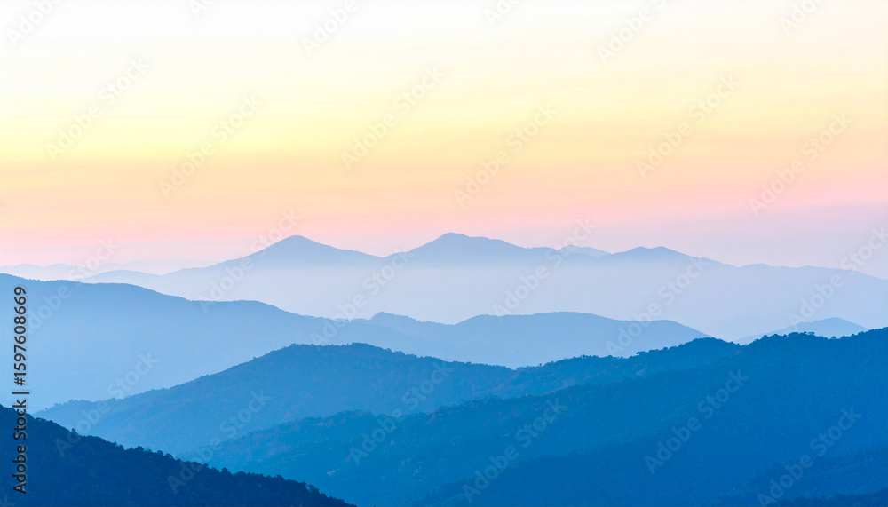 Fototapeta premium Mountain Silhouette at Sunset: A serene vista of majestic mountain ranges fading into the soft hues of a tranquil sunset, evoking a sense of peace and natural wonder.