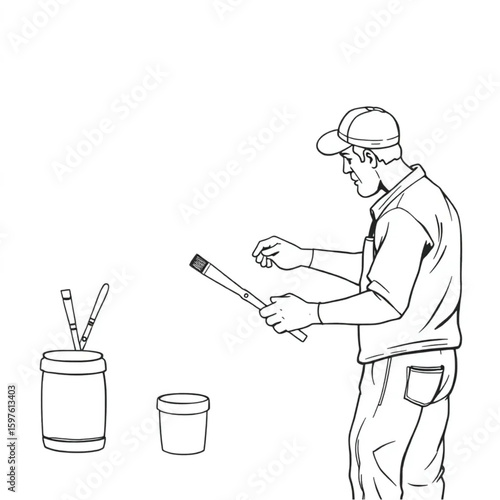 A mural painter cleaning brushes after a long afternoon
