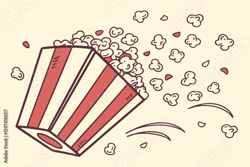 Popcorn spilling from a striped box.